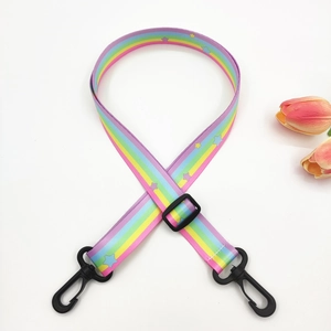 Close-up of rainbow striped 2.5cm bag strap with stars and black plastic swivel hooks