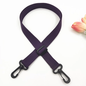 Detail of dark purple woven 2.5cm shoulder strap with black plastic swivel hooks
