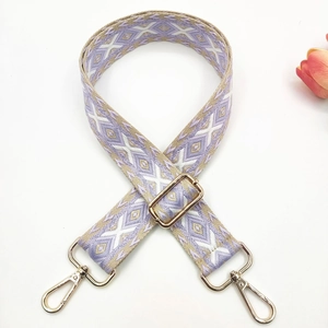 Detail of 3.8cm ethnic wide shoulder strap with lilac geometric embroidery and gold clips