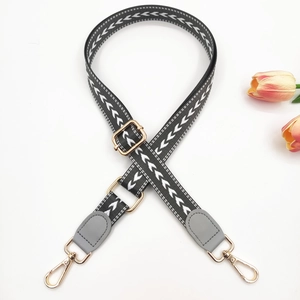 Adjustable woven 2.5cm bag strap with grey arrow patterns and gold metal buckles