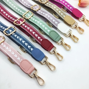 Variety of colorful adjustable shoulder straps with arrow patterns and golden metal clasps