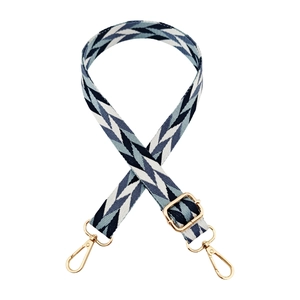 Adjustable geometric woven crossbody bag strap with gold metal hooks and blue chevron pattern