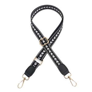 Adjustable black and white arrow pattern shoulder strap with gold metal lobster clasps