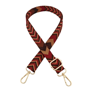 Detail of 2.5cm adjustable jacquard bag strap with wave pattern and gold metal hooks
