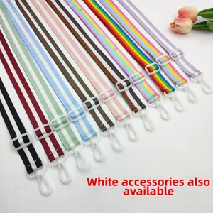 Detail view of colorful striped adjustable bag straps with white plastic swivel hooks