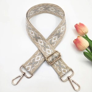 Detail of 3.8cm ethnic style embroidered wide strap with golden metal lobster clasps
