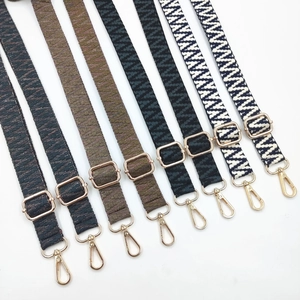 Detailed macro view of bohemian woven bag straps with gold hardware in various colors