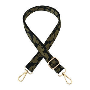 Close-up of leopard pattern strap with gold metal hooks and adjustable buckle
