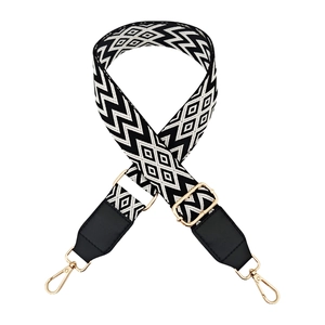 Adjustable wide shoulder strap with black and white geometric wave patterns and gold hooks