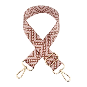 Adjustable woven replacement bag strap with pink and brown wave pattern and gold buckles