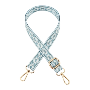 Detail of adjustable blue and white jacquard diamond pattern strap with gold metal hooks