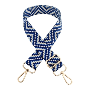 Macro detail of blue and white woven strap with golden lobster clasp and sliding buckle