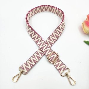 Adjustable woven strap with red-purple geometric patterns and gold lobster clasps