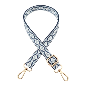 Detail of 2.5cm blue geometric jacquard strap with gold lobster clasps and metal buckle