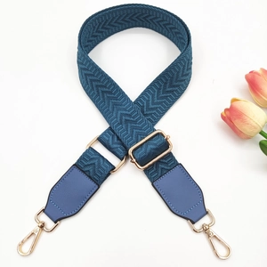 Detail of 3.8cm navy woven strap with chevron pattern and gold adjustable buckle