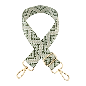 Detail of green and beige woven wide shoulder strap with polished gold-tone metal buckles