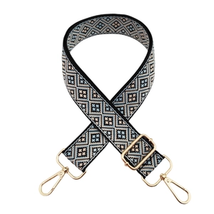 Adjustable ethnic geometric patterned shoulder strap with gold metal lobster clasps