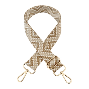Detail of adjustable checkered wide shoulder strap with golden metal lobster clasps