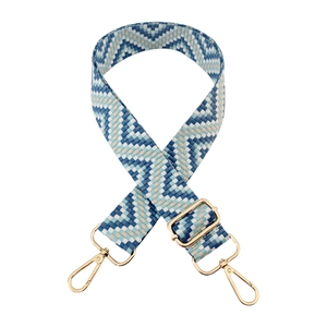 Adjustable bag strap with blue and white geometric wave patterns and gold hardware