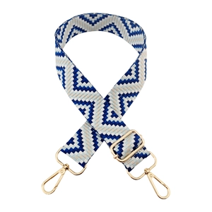 Close-up of blue geometric woven bag strap with golden metal swivel hooks and buckle