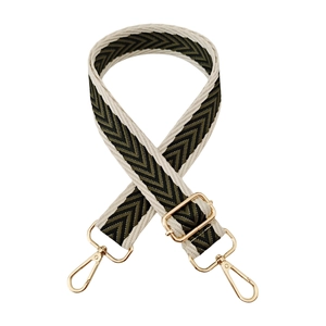 Detail of jacquard chevron strap with pale gold metal hooks and adjustable buckle