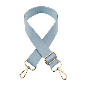 Detailed view of light blue woven strap with premium gold lobster clasps and buckle