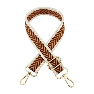 Close-up of adjustable woven strap with brown chevron pattern and gold metal hooks