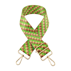 Adjustable wide replacement bag strap with green and brown checkered pattern and gold clips
