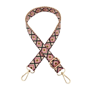 Detail of colorful geometric diamond pattern woven strap with gold metal lobster clasps