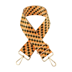 Close-up of colorful checkerboard woven strap with golden metal lobster clasps