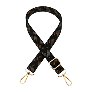 Adjustable black and gold jacquard woven shoulder strap with herringbone pattern