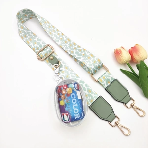 Adjustable leopard print strap with detachable mini clear pouch and gold metal hardware