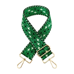 Adjustable green jacquard wide shoulder strap with houndstooth pattern and gold hardware