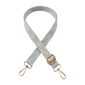 Detail of blue and beige chevron woven strap with polished gold-tone metal hooks