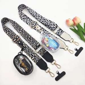 Adjustable leopard print crossbody straps with mini clear pouches and golden metal hardware