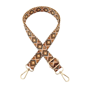 Detail of bohemian geometric rhombus strap with gold swivel hooks and adjuster