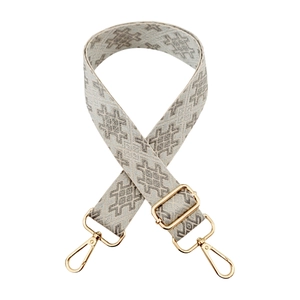 Detail of bohemian geometric jacquard bag strap with premium gold metal swivel hooks
