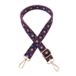Close-up of geometric diamond pattern woven strap with light gold lobster clasps