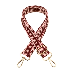 Adjustable red and white chevron shoulder strap with gold metal lobster clasps and buckles