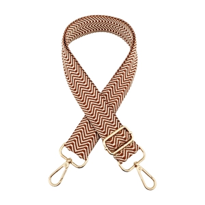 Detail of 3.8cm wide adjustable shoulder strap with brown chevron jacquard and gold hardware