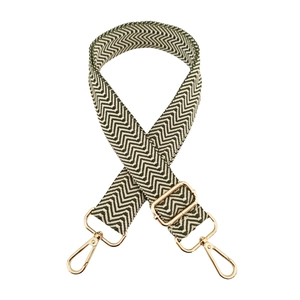 Detailed view of wide adjustable strap with army green chevron pattern and gold hardware