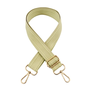 Macro shot of 3.8cm wide embroidered wave jacquard bag strap with gold metal hardware