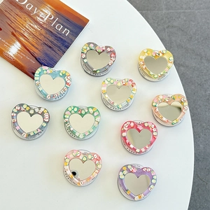 Heart-shaped mirror phone grip set with colorful fruit slice resin design for desktop