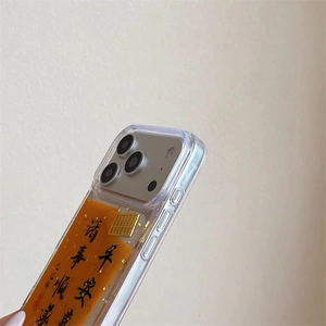 Close-up of clear iPhone case with orange gold leaf and Chinese blessing calligraphy