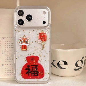 Detailed shot of iPhone case featuring Chinese New Year lion and gold foil flakes
