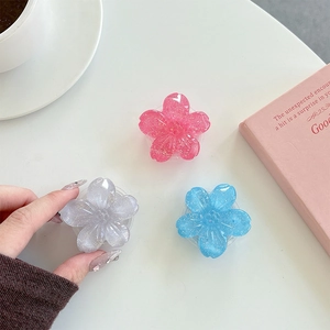 Glittery flower phone socket holder set in pink, blue, and grey resin floral designs