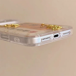 Macro detail of Chinese New Year phone case with gold foil and precise bottom cutouts