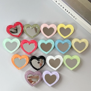 Collage of colorful heart-shaped phone mirrors in 15 vibrant macaron shades
