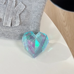 Macro detail of 3D laser heart phone grip with blue gradient multifaceted crystal texture