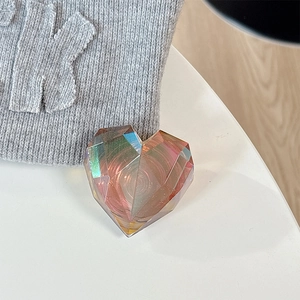 Detail view of the holographic laser heart-shaped phone grip with multi-faceted geometry